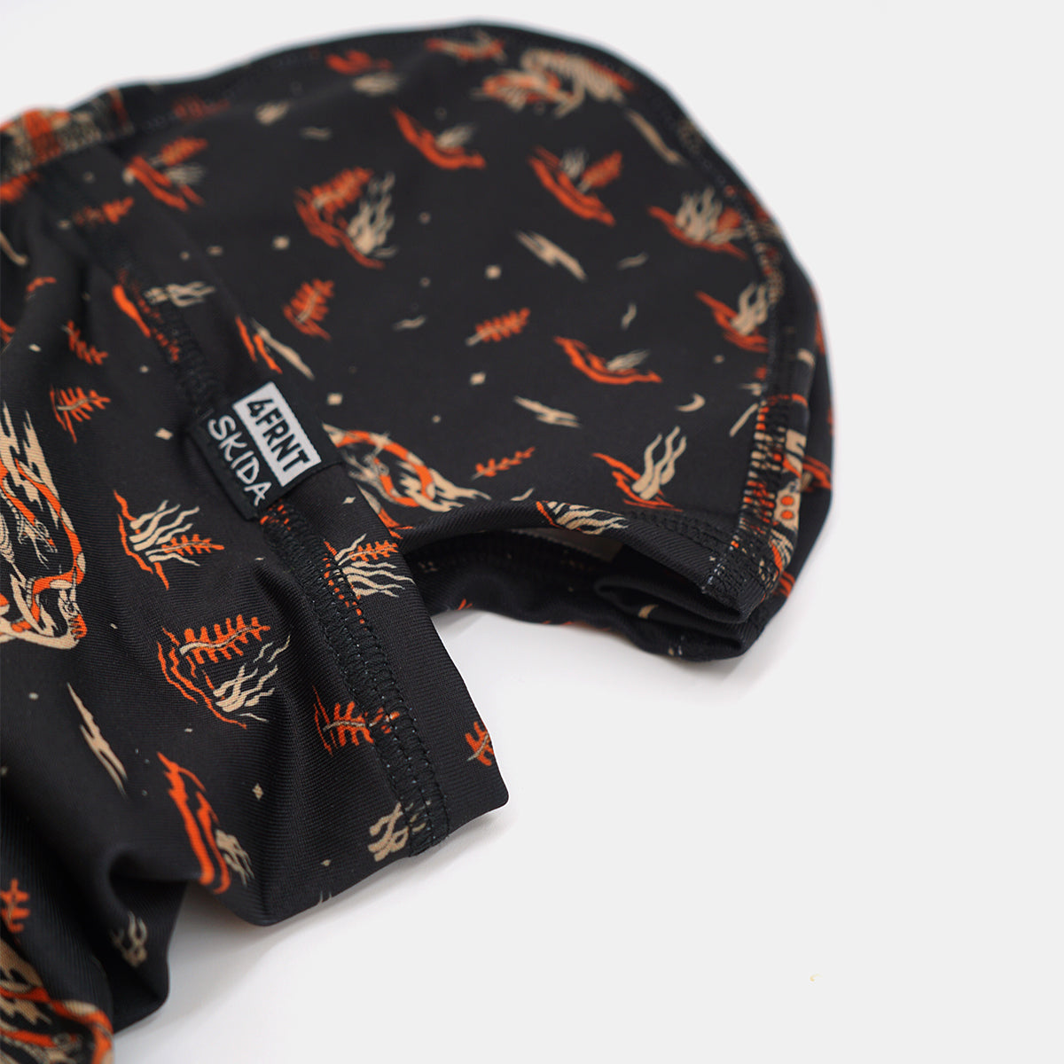 a close up shot of a skida balaclava with campfire print