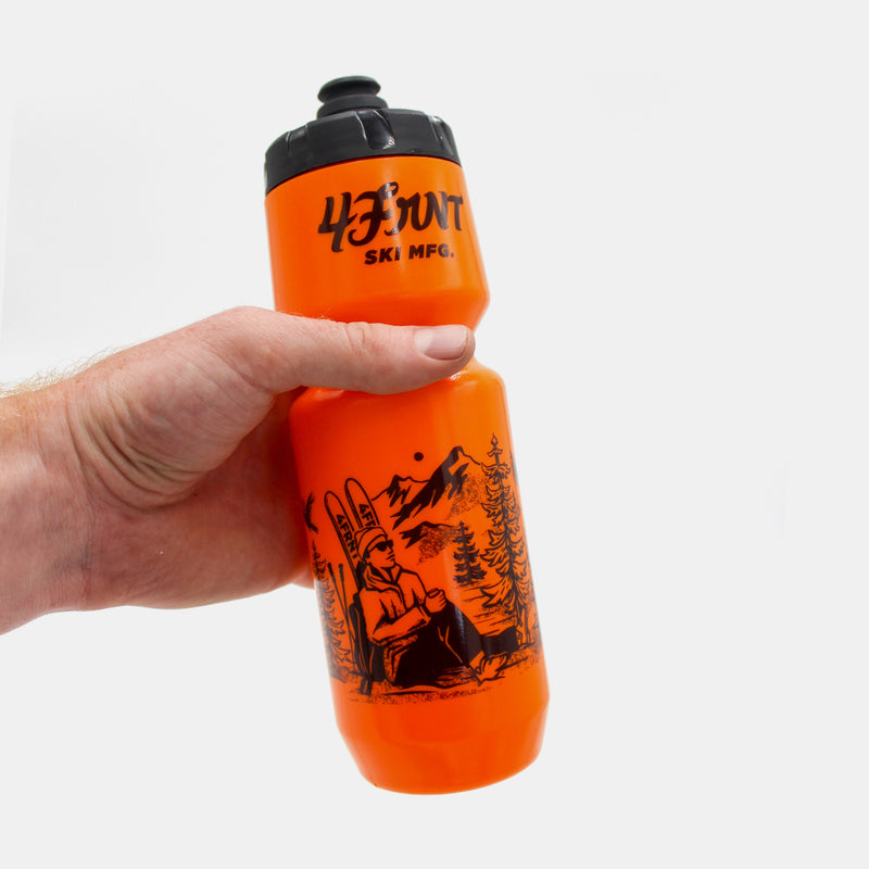 4frnt ski orange Bike Bottle being held by a hand